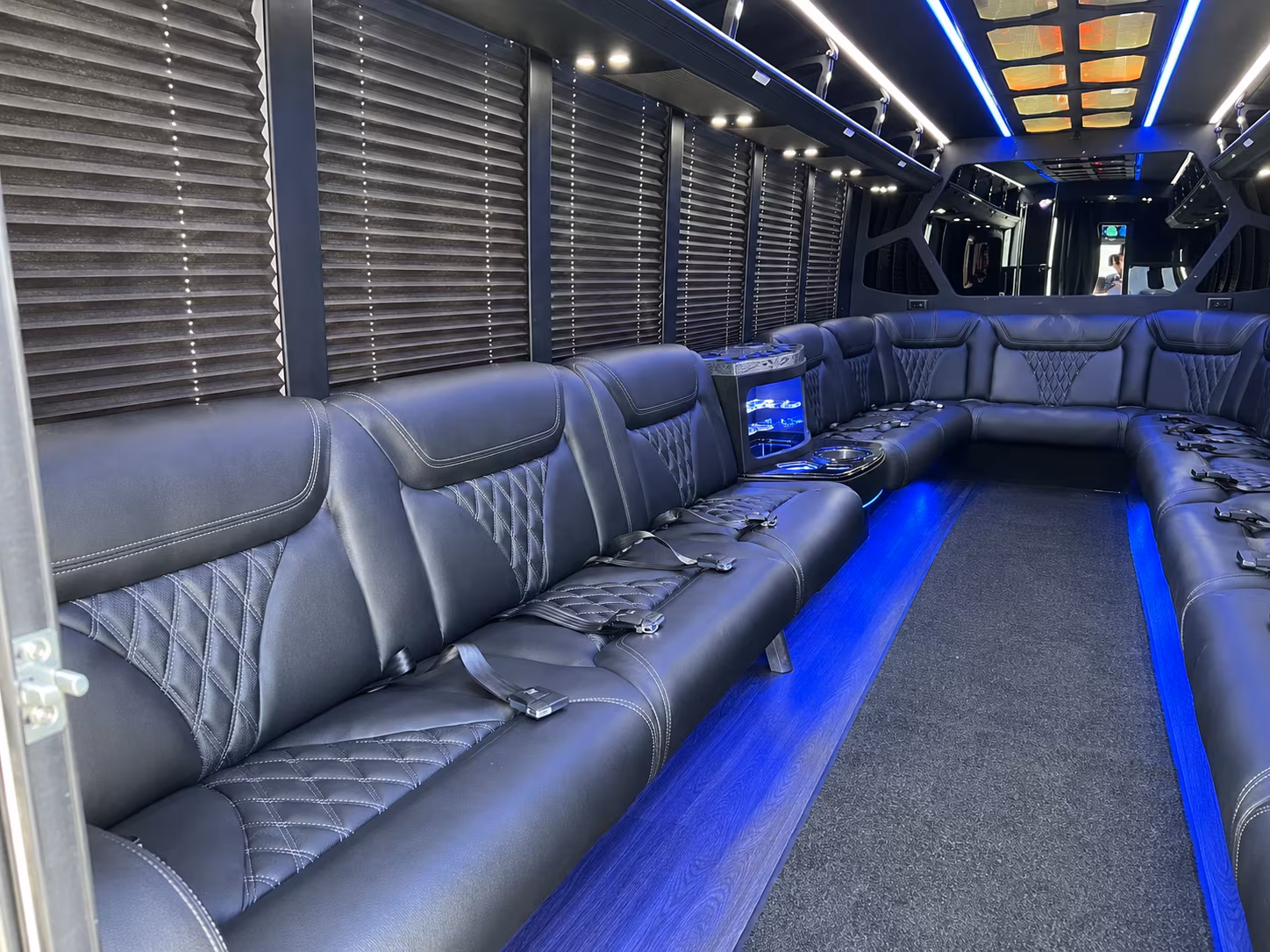 Friends laughing during a party bus celebration in Cary